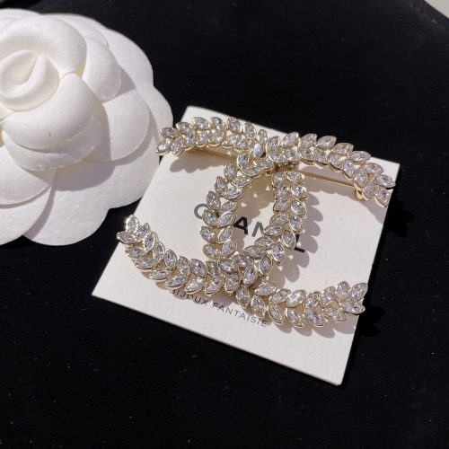 Ch brooch